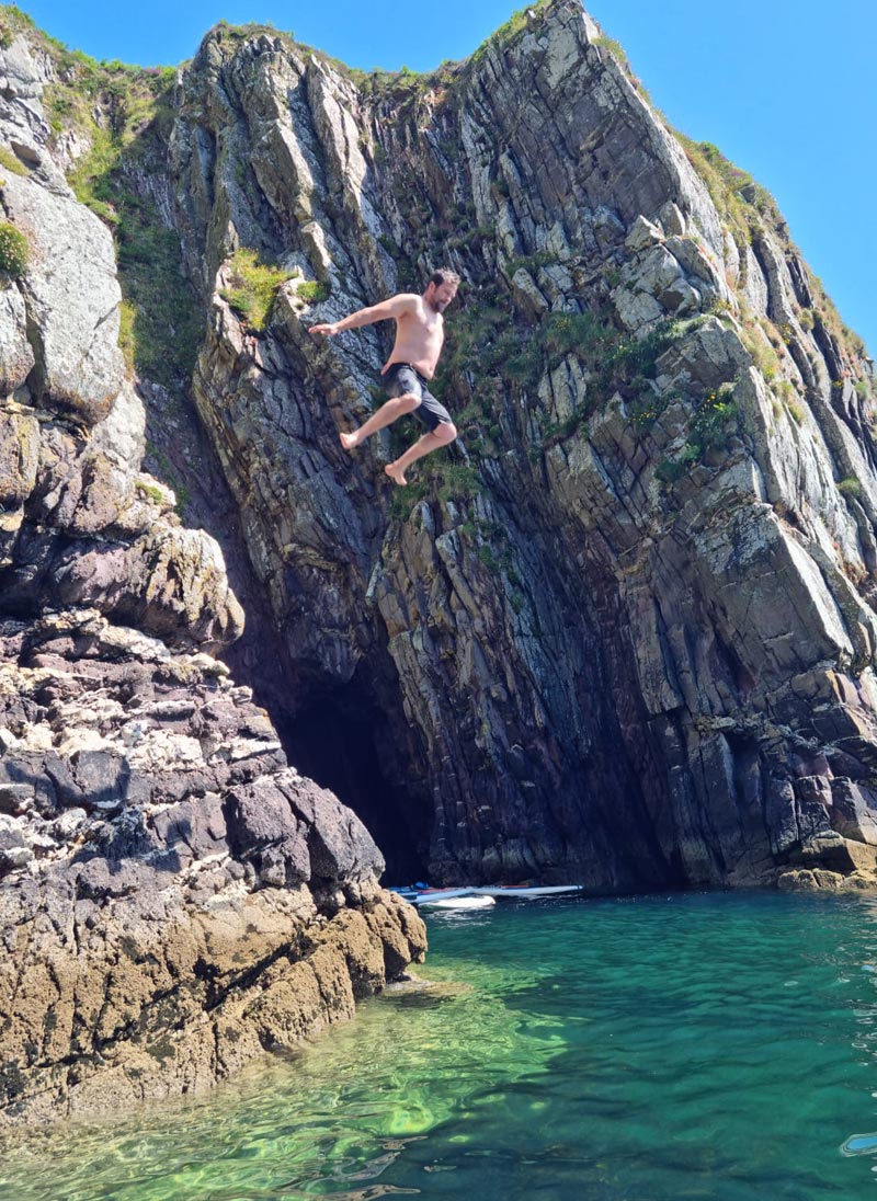 A man jumping from a cliff on the Dingle Peninsula